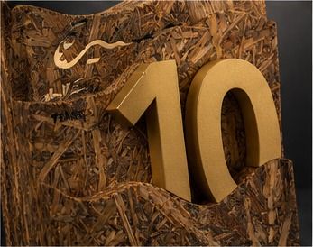 Detail: gold ten emerging between palm-wood waves