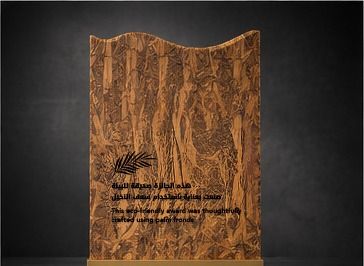 Back of the trophy with the eco-friendly palm-frond inscription